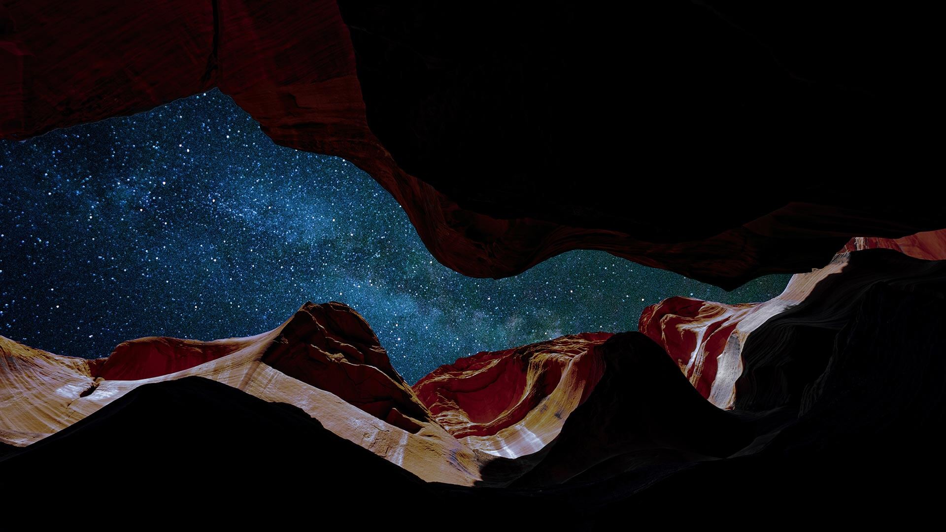 
		A view of a starry sky from inside a slot canyon		