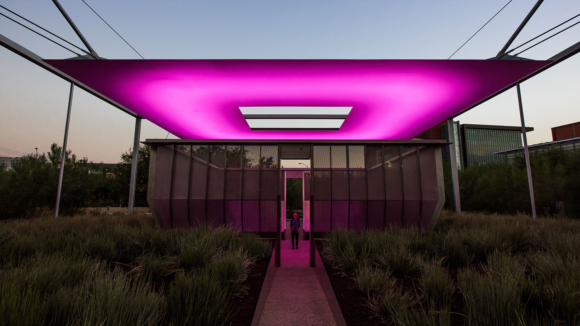 
		A lit magenta shade structure		